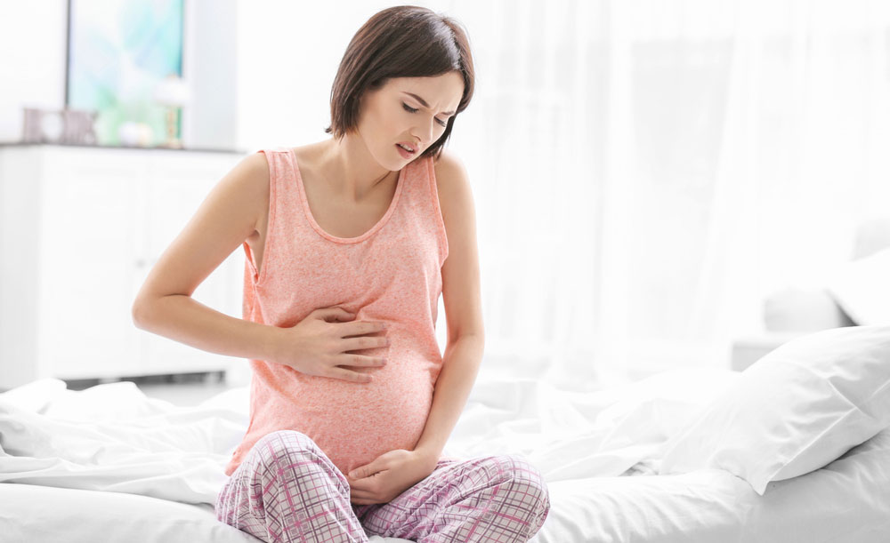 pregnant woman suffering from constipation